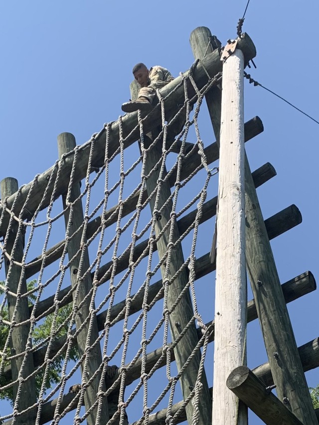 Spc. Christian Kerkado-Colon, a military policeman at Corpus Christi Army Depot, navigates an obstacle during the U.S. Army Materiel Command Best Warrior Competition at Camp Atterbury, Ind., July 26. He was ultimately named the AMC Soldier of the...