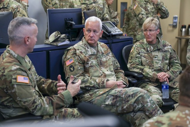 Army Col. Mike Hatfield, left, briefs Lt. Gen. Jon Jensen, the director of the Army National Guard, center, and Brig. Gen. Laura Clellan, the Adjutant General of Colorado, during a demonstration scenario in the Missile Defense Element at Schriever Space Force Base, Colorado, July 26, 2021. Jensen visited the 100th Missile Defense Brigade of the Colorado Army National Guard in Colorado Springs to learn more about the unit and its mission to defend the United States and designated areas from long-range ballistic missile attacks. (U.S. Army National Guard photo by Staff Sgt. Zach Sheely)