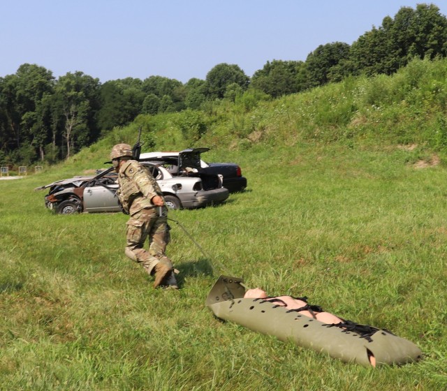 Spc. Christian Kerkado-Colon, a military policeman at Corpus Christi Army Depot, rescues casualty from a building under fire during the U.S. Army Materiel Command Best Warrior Competition at Camp Atterbury, Ind., July 28. Kerkado was ultimately...