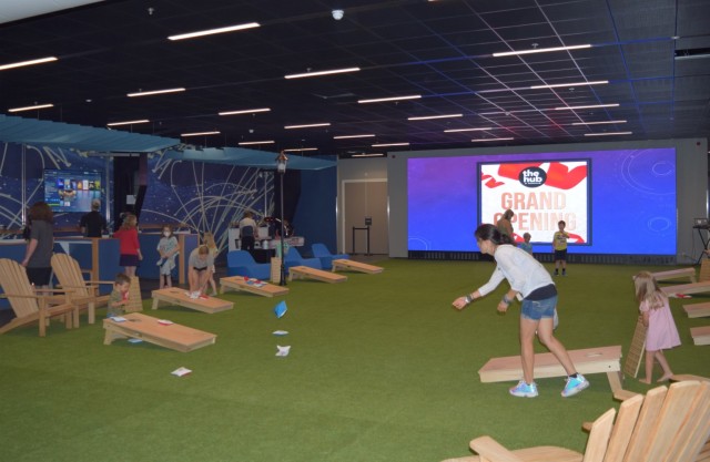 Community members play corn hole and other indoor games at the Hub, the Army’s premier open-concept indoor recreation facility, July 27 at its location at U.S. Army Garrison Benelux – Brunssum. (U.S. Army photo by Jessica Abbas, USAG Benelux Public Affairs)