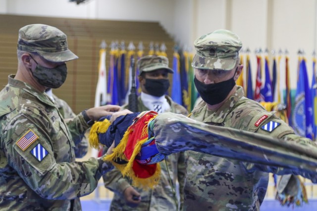 U.S. Army Col. Trent D. Upton, commander of 1st Armored Brigade Combat Team “Raider,” 3rd Infantry Division, and Command Sgt. Maj. James T. Kelly, senior enlisted leader of Raider Brigade, uncase Raider Brigade’s colors during a ceremony August 3, 2021, on Fort Stewart, Georgia.  The ceremony marked the official redeployment of the Brigade—known as the Battle Axe of the 3rd ID—after a nine month rotation to the Republic of Korea. (U.S. Army photo by Staff Sgt. Daniel Guerrero)