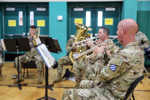 The 3rd Infantry Division band performs during an uncasing ceremony for 1st Armored Brigade Combat Team “Raider,” 3rd ID, August 3, 2021, on Fort Stewart, Georgia. The ceremony marked the official redeployment of the Brigade—known as the Battle Axe of the 3rd ID—after a nine month rotation to the Republic of Korea. (U.S. Army photo by Spc. Summer Keiser)