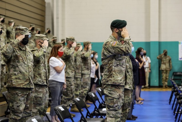 Soldiers assigned to 1st Armored Brigade Combat Team “Raider,” 3rd Infantry Division, Families and friends render honors during Raider Brigade’s uncasing ceremony August 3, 2021, on Fort Stewart, Georgia. The ceremony marked the official redeployment of the Brigade—known as the Battle Axe of the 3rd ID—after a nine month rotation to the Republic of Korea. (U.S. Army photo by Spc. Summer Keiser)
