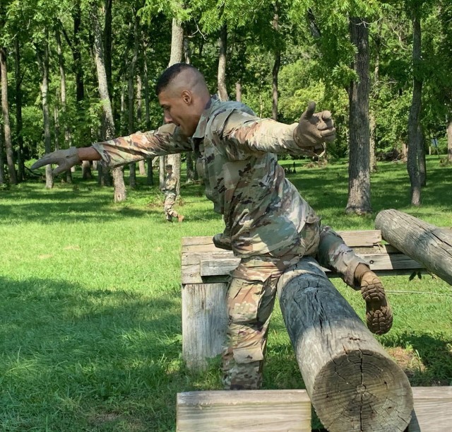 Spc. Christian Kerkado-Colon, a military policeman at Corpus Christi Army Depot, navigates an obstacle during the U.S. Army Materiel Command Best Warrior Competition at Camp Atterbury, Ind., July 26. He was ultimately named the AMC Soldier of the...