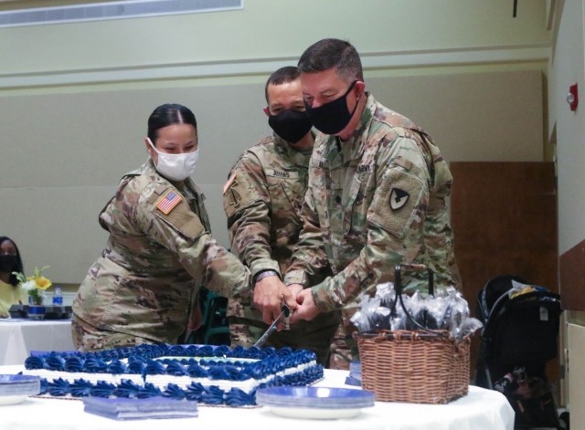 U.S. Army Brig. Gen. Jasper Jeffers (center), 3rd Infantry Division deputy commanding general for maneuver, cuts a cake with two other Soldiers in celebration of the Army Chaplain Corps’ 246th birthday during an event on Fort Stewart, Georgia,...