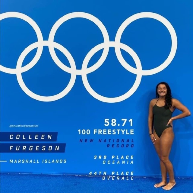 Representing the Republic of the Marshall Islands, Colleen Furgeson smiles for the camera with her swim record—a powerful 58.71 for her 100-meter freestyle earning her third place for Oceania and 44th place overall.