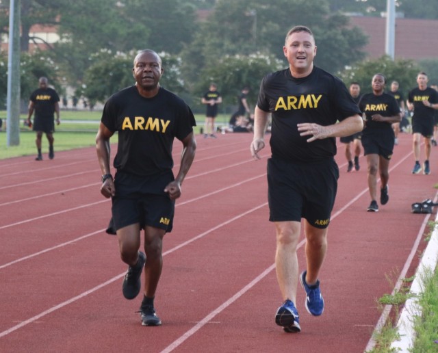 U.S. Army  Capt. (CH) Peter Nwokoye and  Lt. Col. (CH) Christopher Wallace, both assigned to 3rd Infantry Division, run together during a day-long celebration of the Army Chaplain Corps’ 246th birthday on Fort Stewart, Georgia, July 30, 2021. Unit ministry teams from across post came together during the celebration, which included an award ceremony, a leader professional development session, promotions and a cake cutting.(U.S. Army photo by Pfc. Michael Udejiofor/50th Public Affairs Detachment)