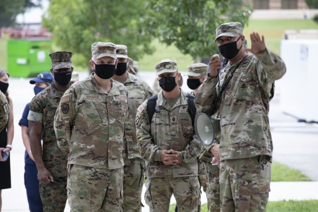 U.S. Air Force Gen. Glen VanHerck, commander of North American Aerospace Defense Command and U.S. Northern Command, and U.S. Marine Corps Sgt. Maj. James Porterfield, NORAD and USNORTHCOM Command Senior Enlisted Leader (far left), visited Task...