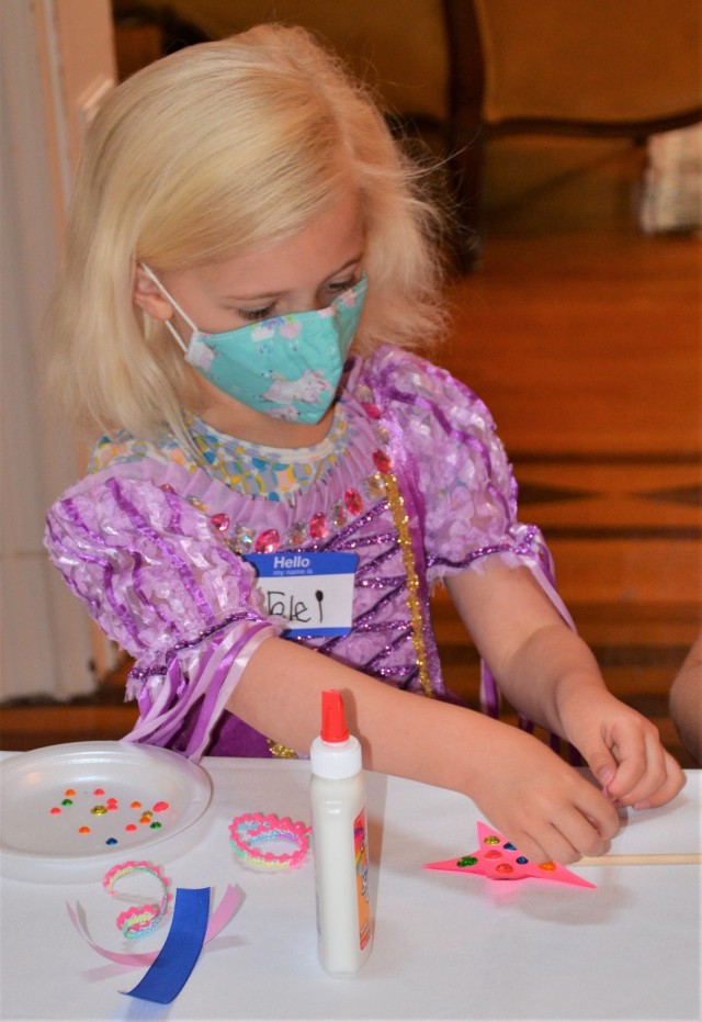 Princess Lorelai puts the finishing touches on her magic wand during the “Storytime with Princesses” event held at Rock Island Arsenal, Illinois, July 17.
