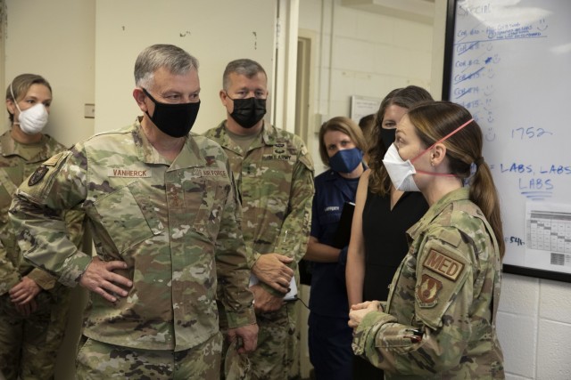 U.S. Air Force Gen. Glen VanHerck, commander of North American Aerospace Defense Command and U.S. Northern Command, receives a briefing from the Task Force Eagle medical support staff during his tour of the facilities being used in support of...
