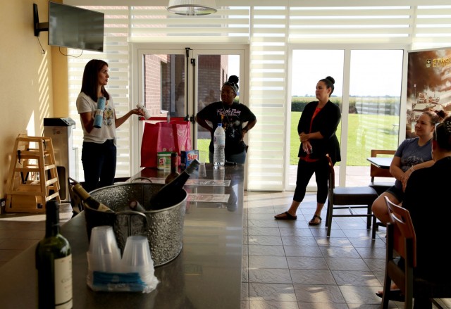 Coren Yastrzemsky, left, wife of the U.S. Army Garrison Benelux commander, talks with community members during Wine and Whine Wednesday July 28, 2021 at the Chièvres Army Lodge at Chièvres Air Base, Belgium. The Wednesday event began at the...