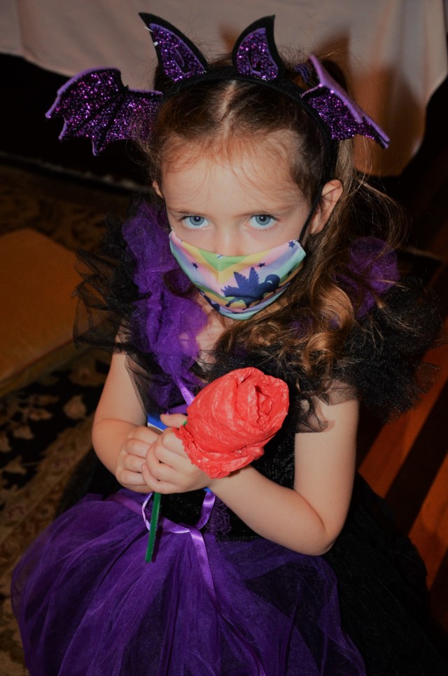 Princess Caroline holds her fairytale rose she made at the craft table activity during the during the “Storytime with Princesses” event held at Rock Island Arsenal, Illinois, July 17.