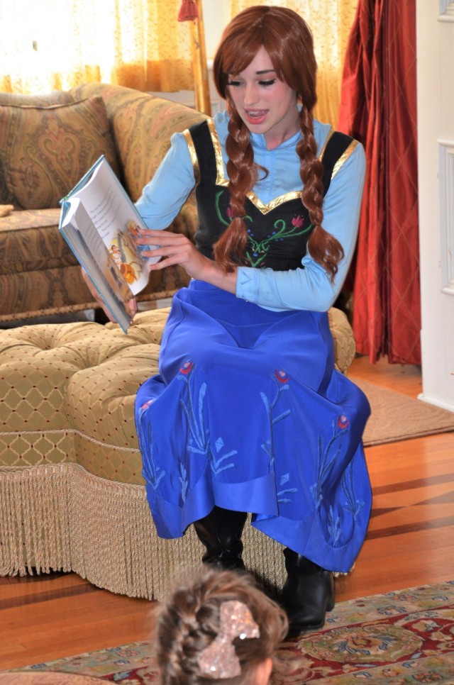 Princess Anna (Brooklyn Schnell), reads a story to attendees in the historic Quarters 1 from parlor at Rock Island Arsenal, Illinois, July 17.