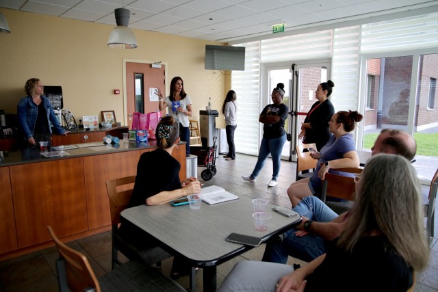 Coren Yastrzemsky, center, wife of the U.S. Army Garrison Benelux commander, talks with community members during Wine and Whine Wednesday July 28, 2021 at the Chièvres Army Lodge at Chièvres Air Base, Belgium. The Wednesday event began at the...
