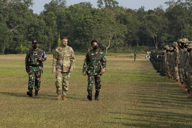 A U.S. Army Soldier with the 82nd Airborne Division, and his Tentara Nasional Indonesia (Indonesian Armed Forces) counterpart fistbump at the Baturaja Training Area, on August 4, 2021. Garuda Shield 21 is a two-week joint-exercise between the United States Army and Tentara Nasional Indonesia (TNI-AD Indonesia Armed Forces). The purpose of this joint-exercise is to enhance and enrich the jungle warfare ability of both the U.S. Army and Indonesian Army. (U.S. Army photo by Spc. Rachel Christensen)