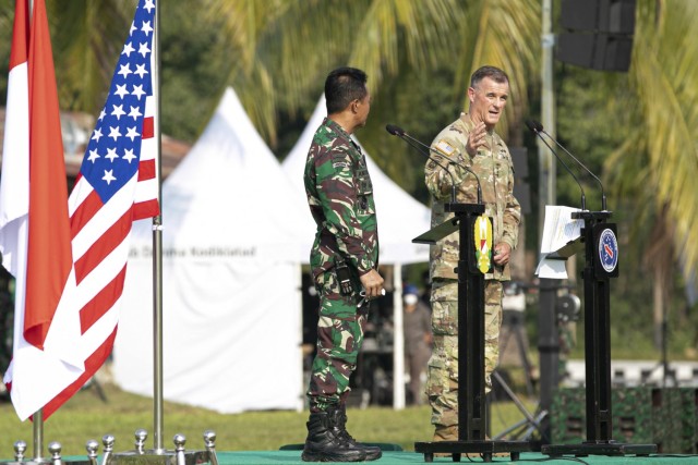 U.S. Army Gen. Charles Flynn, commanding general of the U.S. Army Pacific, and Gen. Andika Perkasa, Chief of Staff of the Indonesian Army, stand together during the opening ceremony for Garuda Shield 21 at the Baturaja Training Area, on August 4, 2021. Garuda Shield 21 is a two-week joint-exercise between the United States Army and Tentara Nasional Indonesia (TNI-AD Indonesia Armed Forces). The purpose of this joint-exercise is to enhance and enrich the jungle warfare ability of both the U.S. Army and Indonesian Army. (U.S. Army photo by Spc. Rachel Christensen)
