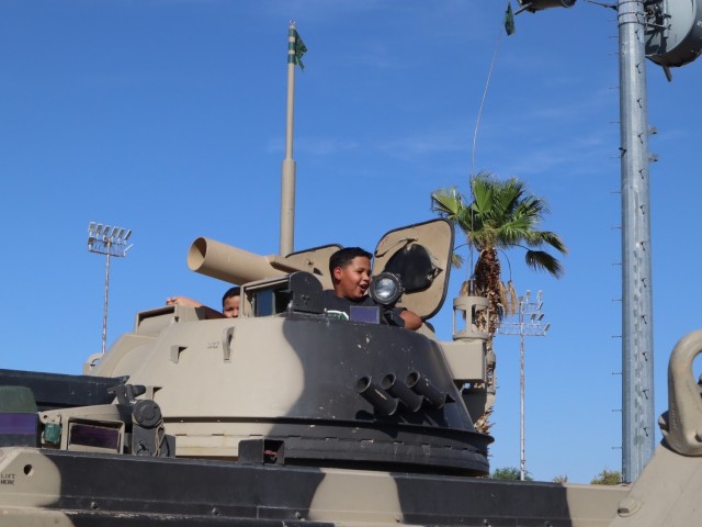Kids explore tanks set up by the 11th ACR at the Back to School Bash