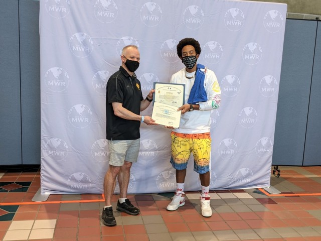 Garrison Commander Col. Christopher Ruga presents two Certificates of Appreciation to Ludacris before Fort Wainwright's summer concert June 5. The outdoor concert featured performances by rapper and movie star Chris "Ludacris" Bridges, country...