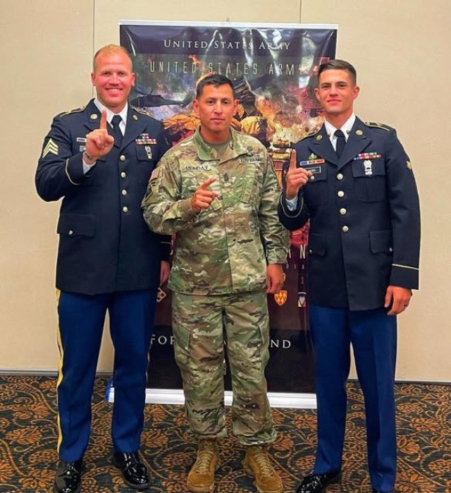 Sgt. Hunter Wilson (left), FORSCOM Noncommissioned Officer of the Year, stands with Cmd. Sgt. Maj. Shade Munday (center), and Spc. Matthew Yates, runner-up for FORSCOM Best Soldier of the Year, at Fort Riley, KS Aug. 5, 2021