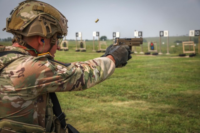 U.S. Army Staff Sgt. Logan Engle, a noncommissioned officer assigned to Security Forces Assistance Command, fires at a paper target using an M17 during the Stress Shoot event of the 2021 FORSCOM Best Warrior Competition, Aug. 2, 2021, at Fort...