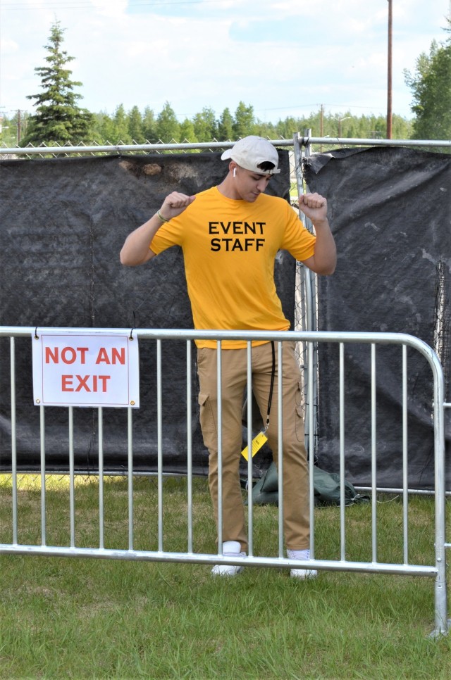 An event volunteer enjoys the music during Fort Wainwright's summer concert June 5. The outdoor concert featured performances by rapper and movie star Chris "Ludacris" Bridges, country singer Brantley Gilbert, and comedian Ronnie Jordan. (Photo by...