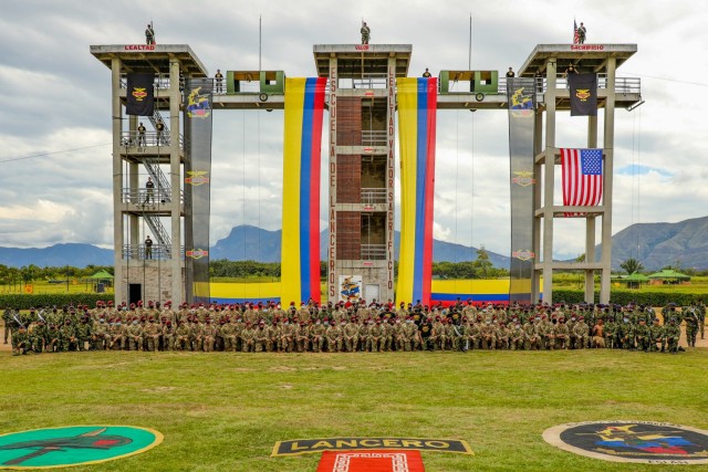 U.S. Army and Colombian army paratroopers stand in front of the Lancero School air assault platform, July 30, 2021, at Tolemaida Air Base, Colombia. The U.S. and Colombian armies exchanged airborne badges during the closing ceremony of the six-day...