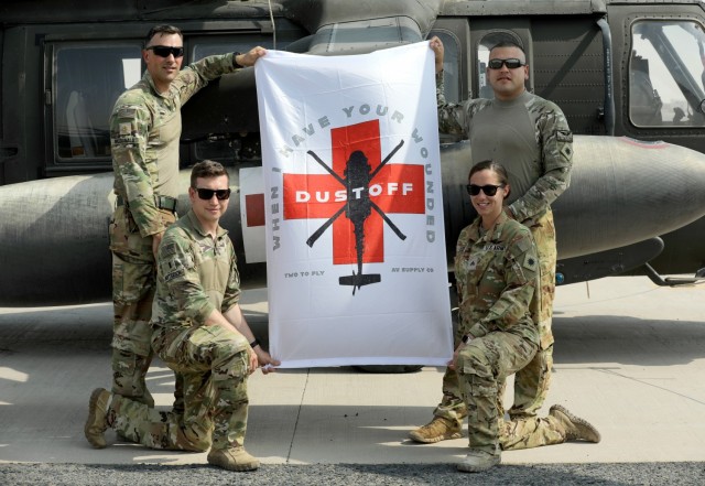 A Task Force Phoenix MEDEVAC crew from G Company, 1st Battalion, 168th Aviation Regiment (General Support Aviation Battalion), known as DUSTOFF, poses for a photo at Camp Buehring, Kuwait. The fully vaccinated crew took extra precautions during a...