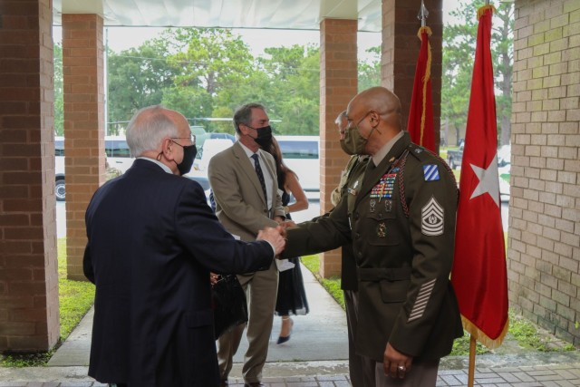 U.S. Army Command Sgt. Maj. Quentin Fenderson and Maj. Gen. Charles D. Costanza, the command team of the 3rd Infantry Division, greet the family of Purple Heart Medal-recipient 1st Lt. Thomas R. Beasley on Fort Stewart, Georgia, Aug. 9, 2021. The Purple Heart Medal is a U.S. military medal awarded to any service member that has been wounded or killed in action. (U.S. Army photo by Pfc. Michael Udejiofor/50th Public Affairs Detachment)