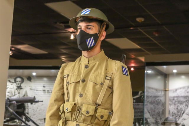 U.S. Army Spc. Phillip Barrersi, a member of the 3rd Infantry Division Color Guard, poses at an award ceremony for 1st Lt. Thomas R. Beasley on Fort Stewart, Georgia, Aug. 9, 2021. Barrersi donned the “Doughboy” uniform that Soldiers wore...