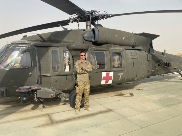 Chief Warrant Officer 3 Jacob Wootton, from G Company, 1st Battalion, 168th Aviation Regiment (General Support Aviation Battalion), poses for a photo in front of a DUSTOFF UH-60 Black Hawk helicopter. Wootton was the pilot-in-command during a...
