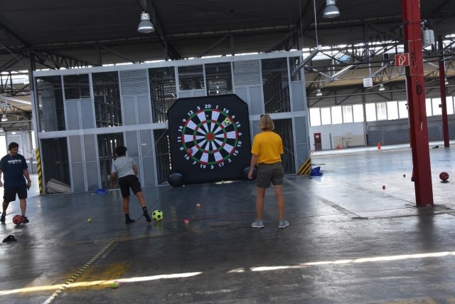 Members of the community play velcro darts during organization day July 30, 2021.