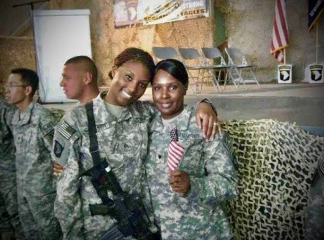 Sgt. Stacy-Ann Smelser hugs her mother, Spc. Carol E. Newland, in 2008 at Bagram Air base, Afghanistan. Mother and daughter served together and were deployed while assigned to the 101st Sustainment Brigade at Fort Campbell, Kentucky.