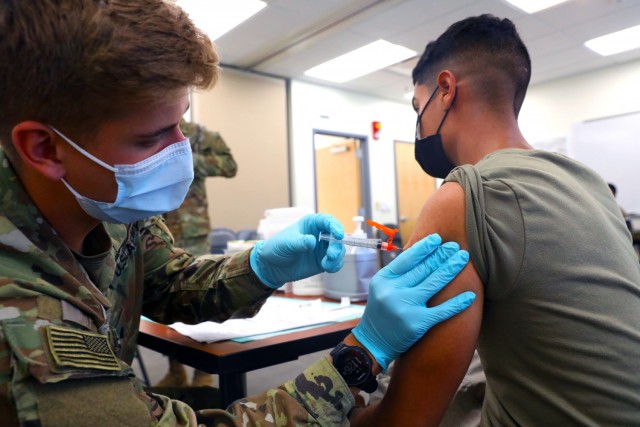 Spc. Tyler Boyer, a Hayden, Colorado native and medical specialist assigned to the 1st Stryker Brigade Combat Team, 4th Infantry Division, administers the COVID-19 vaccine at Fort Carson, Colorado Aug 3, 2021. The 4th Inf. Div. remains committed...