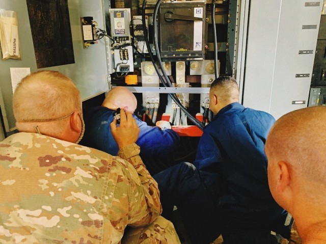 Members of the 118th Civil Engineer Squadron prepare to attach generator power to the Army National Guard Armory on Holtzclaw Avenue in Chattanooga on August 7 as part of Vigilant Guard 2021 exercise.