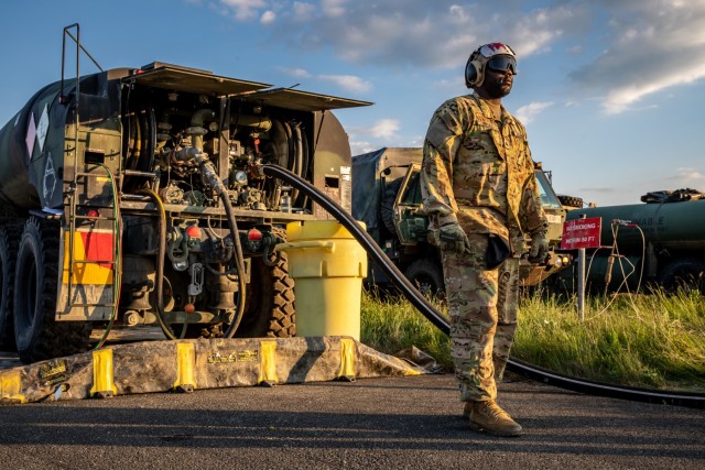 Sgt. Nicholas Bostic, a 92F, petroleum supply specialist, conducts forward arming and refueling operations June 1 for the 1-3rd Attack Battalion during the landing of two UH-72 Lakota helicopters assigned to the 7th Army Training Command at Tazar, Hungary, during exercise Saber Guardian in support of Defender-Europe 21. 