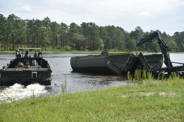 926th Engineer Brigade Soldiers guide collapsible raft into the water at Fort Stewart, Ga. on 20 June