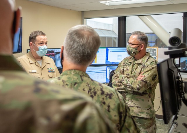 SAN DIEGO (Oct. 21, 2020) Army Maj. Gen. Michael Place, 18th Medical Command’s (MEDCOM) (Deployment Support) commander (right), tours Naval Medical Center San Diego’s (NMCSD) Joint Tele-Critical Care Network operations center Oct. 21. Place is traveling to military hospitals around the country, visiting with leadership to discuss the future of military medicine, since taking command of the 18th MEDCOM (DS) earlier this year. The 18th MEDCOM (DS) is an expeditionary medical command that ensures readiness and coordinates medical functions in integrated, multi-domain joint force operations. NMCSD’s mission is to prepare service members to deploy in support of operational forces, deliver high quality healthcare services and shape the future of military medicine through education, training and research. NMCSD employs more than 6,000 active duty military personnel, civilians, and contractors in Southern California to provide patients with world-class care anytime, anywhere. (U.S. Navy photo by 