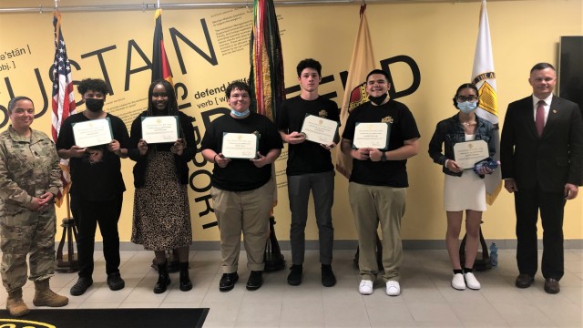 IMCOM-Europe Director Tommy Mize and Command Sgt. Maj. Samara Pitre recognize participants from the summer hire program: Josiah Fleming, Tyra Williams, Peter Cole, Jay Mattes, Anthony Mayuri and Sontee Mickens.