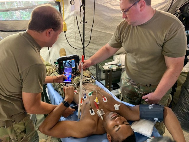 Soldiers from the 126th Forward Resuscitative Surgical Detachment (FRSD) test new medical equipment during exercise Garuda Shield in Bataraja, Indonesia Aug, 2, 2021. The FRSD exercised the Joint Tele-Critical Care Network using the Tempus Pro, BATDOK, OmniCure and communication software platforms. The practice session was extremely successful despite minimal bandwidth; images and live video were sent out via MiFi puck. Both physician and nursing staff at the JTCCN location were able to clearly visualize all facets of care being supported including a FAST exam.