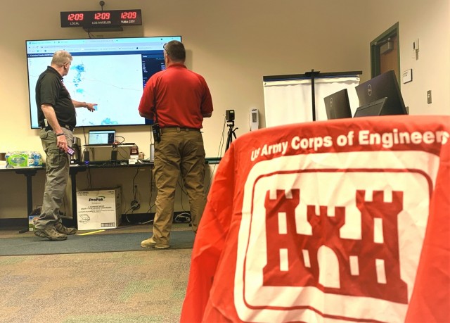 Wes Dison and Tim Carter, both with the Coconino County Emergency Operations Center, track an approaching thunderstorm during emergency flood response operations July 30 in Flagstaff, Arizona The U.S. Army Corps of Engineers Los Angeles...