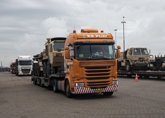 A semi tractor-trailer carrying a low-mobility tactical vehicle drives out of the secure gate at the Port of Vlissingen, Netherlands, Oct. 14, 2019. Coordinated by the 598th Transportation Brigade and 838th Transportation Battalion, line-haul is one of four transportation methods used to move the equipment across Europe in support of Atlantic Resolve. Moving equipment through multiple transportation modes is one way of reassuring NATO allies and partners of the United States’ continued commitment to rapidly deploying combat credible forces across the region. 