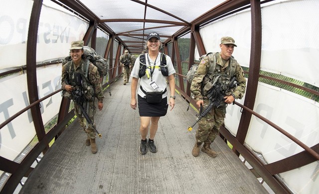 U.S. Military Academy Class of 1994 graduate Brandi Peasley walks with the new cadets during March Back Monday.