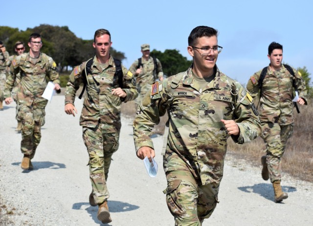 Pfc. Ryan Myrick, assigned to Company C, 229th Military Intelligence Battalion, runs with members of his team during a battalion-level land navigation competition at Fort Ord National Monument, Calif., Aug. 7, 2021.