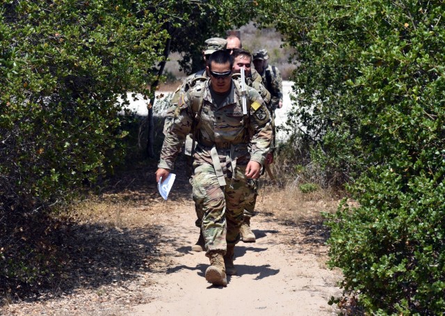 Spc. Julian Taitague, assigned to Company D, 229th Military Intelligence Battalion, leads his team during a battalion-level land navigation competition at Fort Ord National Monument, Calif., Aug. 7, 2021.
