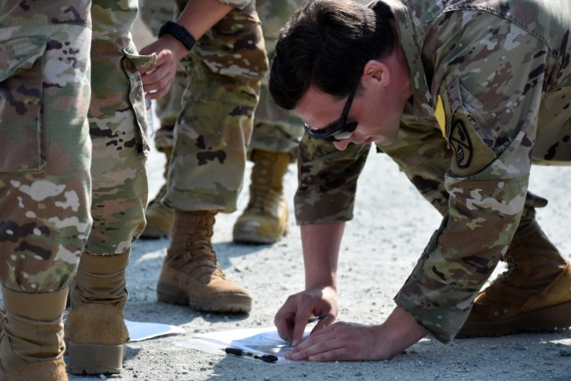 A Soldier assigned to the 229th Military Intelligence Battalion helps his team navigate during a battalion-level land navigation competition at Fort Ord National Monument, Calif., Aug. 7, 2021.