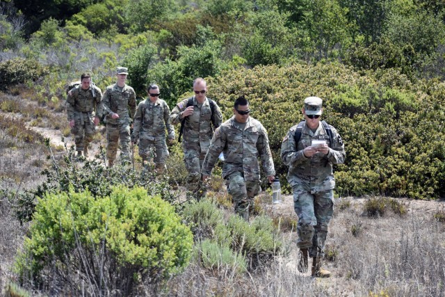 Spc. Bryan Roukie, assigned to Company D, 229th Military Intelligence Battalion, leads his team during a battalion-level land navigation competition at Fort Ord National Monument, Calif., Aug. 7, 2021.
