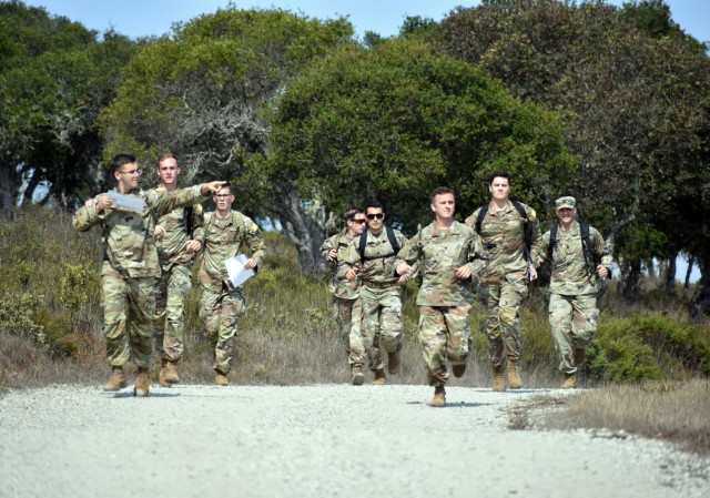 Members of Company C, 229th Military Intelligence Battalion, run to a land navigation point during a battalion-level land navigation competition at Fort Ord National Monument, Calif., Aug. 7. Lt. Col. Matthew Upperman, far right, commander of the 229th MI Bn., ran with the team throughout the course.