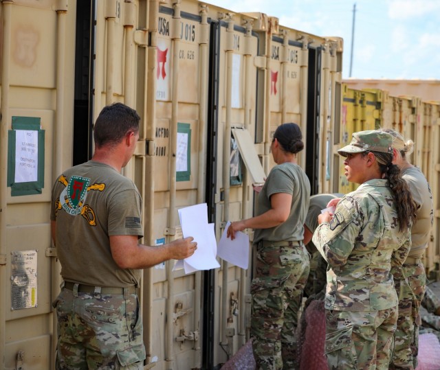 Soldiers assigned to 3rd Brigade Combat Team, 101st Airborne Division (Air Assault) conduct inventory of the container express boxes at the Fort Campbell Railhead August 10th, as they prepare to ship them out to Port Charleston, S.C. for their Sea...