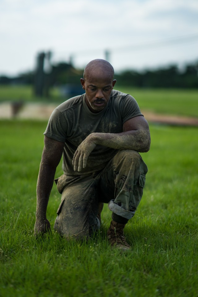 U.S. Army Staff Sgt. Corey Walton, assigned to U.S. Army North, takes a knee after completing an obstacle course during the Army Futures Command Best Warrior Competition at Joint Base San Antonio-Fort Sam Houston, Texas, June 8, 2021. The 2021 Army Futures Command Best Warrior Competition recognizes Soldiers who demonstrate commitment to the Army values, embody the Warrior Ethos, and represent the Force of the Future. (U.S. Army photo Sgt. David Cook)