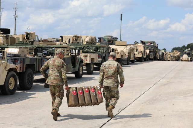 Soldiers assigned to 3rd Brigade Combat Team, 101st Airborne Division (Air Assault) transport fuel containers onto the Fort Campbell Railhead August 10th in preparation for their Sea Emergency Deployment Readiness Training Exercise. SEDRE’s...